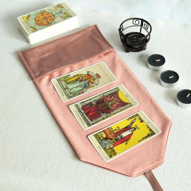 A tarot card spread on a velvet cloth, representing psychic readings for love.